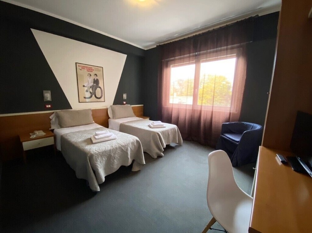 Hotel Santin - Tap to explore photos